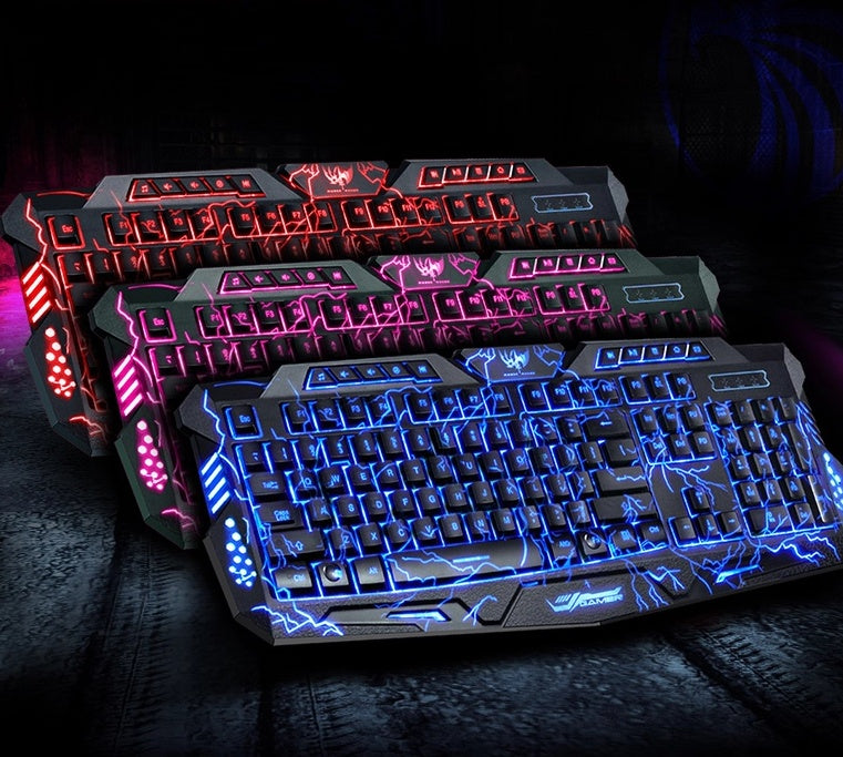 Gaming keyboards with colorful LED lighting on a dark surface
