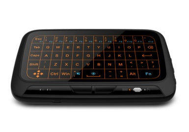Black keyboard-style remote control with orange backlight on a white background