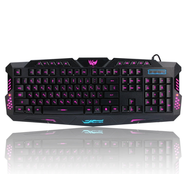 Gaming keyboard with purple backlighting on a white background