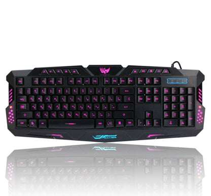 Gaming keyboard with purple backlighting on a white background